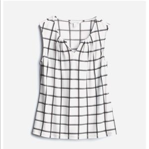 Sleeveless split neck knit top.